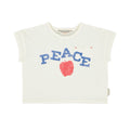 White sleeveless top with 'PEACE' and an apple graphic 