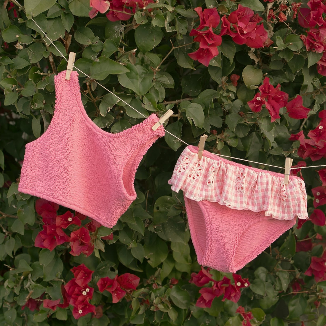 Pink textured bikini set with white trim