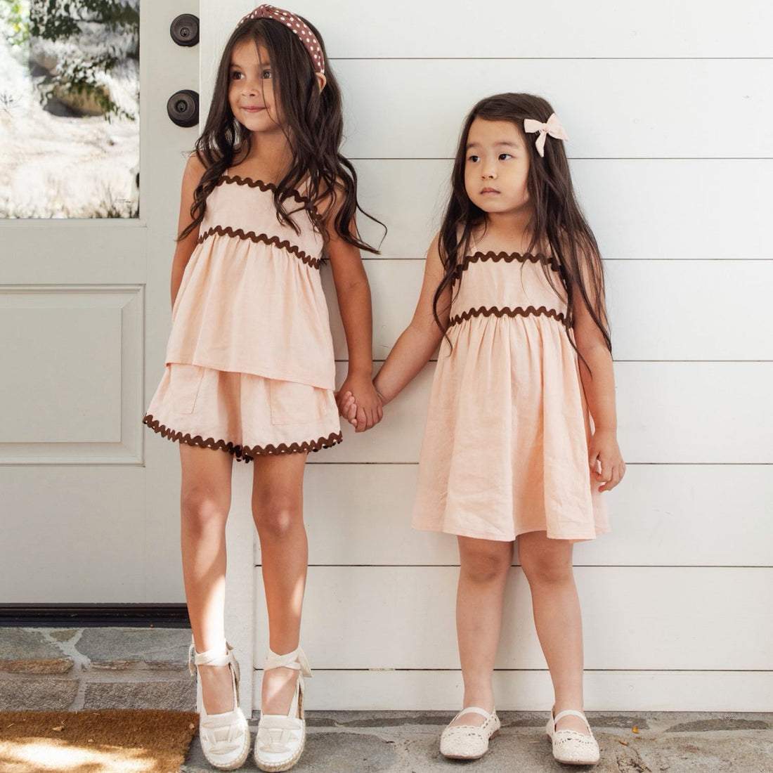 Pink dress with brown trim 