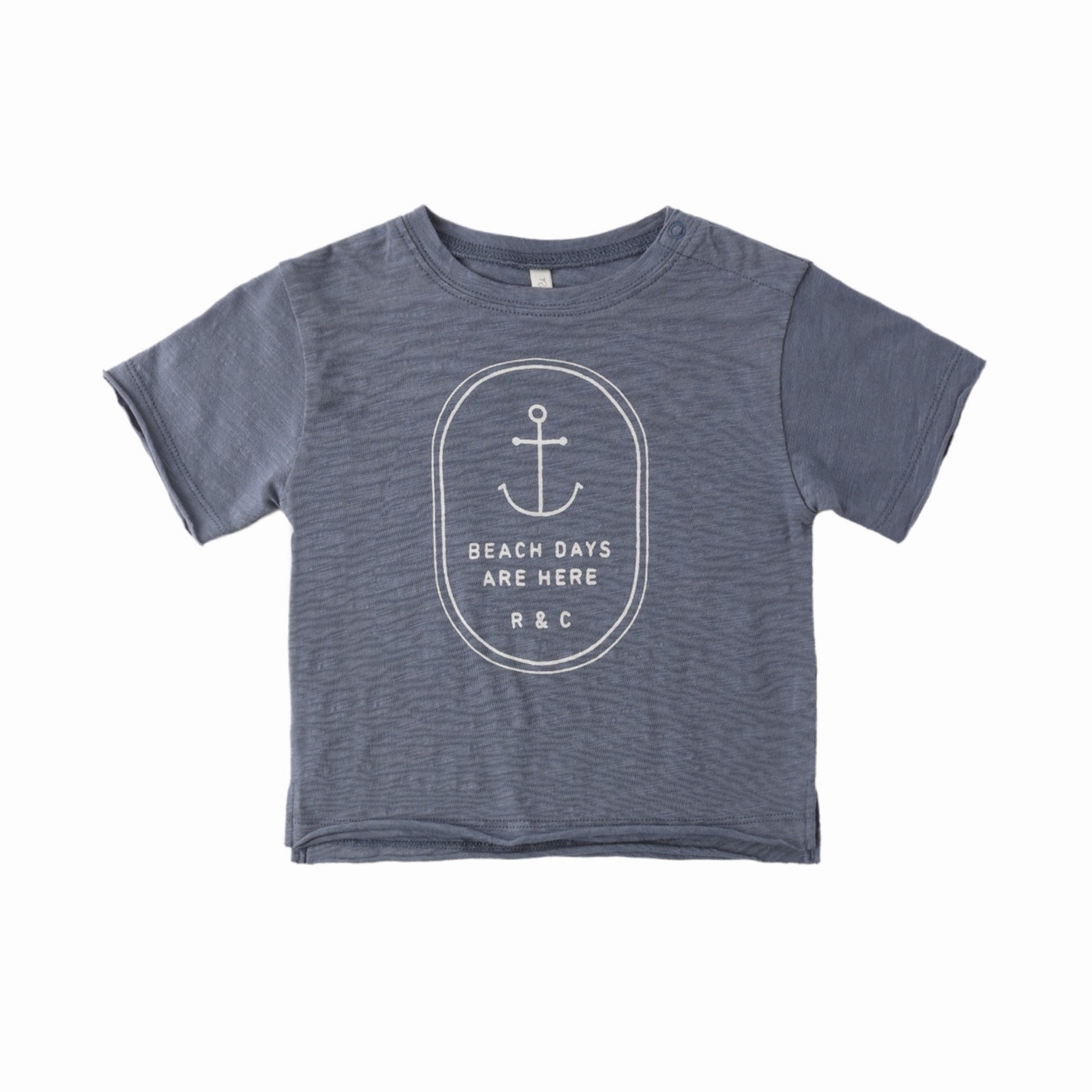 Blue t-shirt with white anchor design and white text