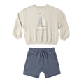 Children's beige sweatshirt with sailboat design and blue shorts 